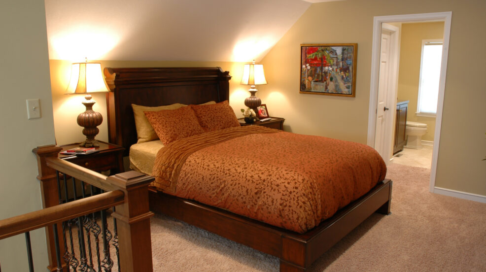 Jacobson Construction Wrought Iron Railing Adds Flair to Second Floor Bedroom