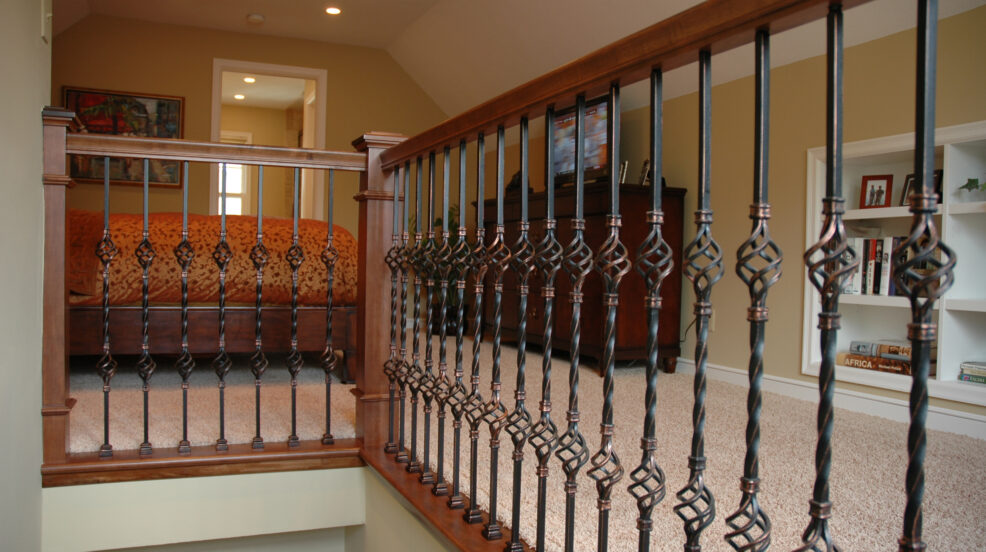 Jacobson Construction Wrought Iron Railing Adds Flair to Second Floor Bedroom