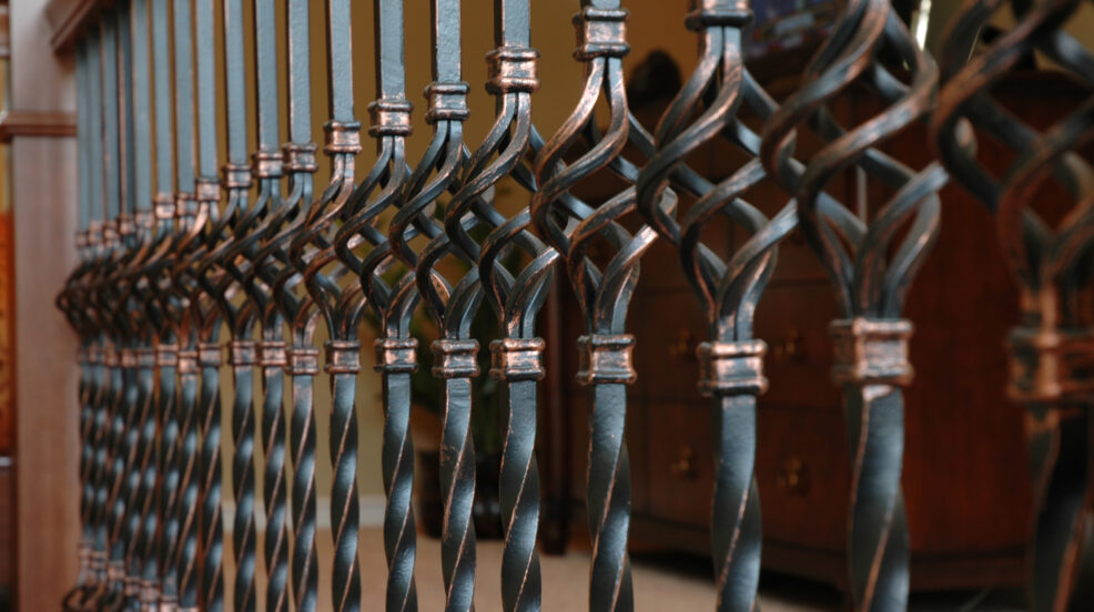 Jacobson Construction Wrought Iron Railing Adds Flair to Second Floor Bedroom